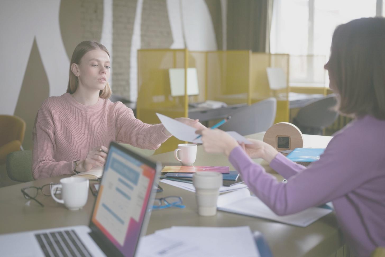 Professional event coordination team reviewing planning details and logistics
